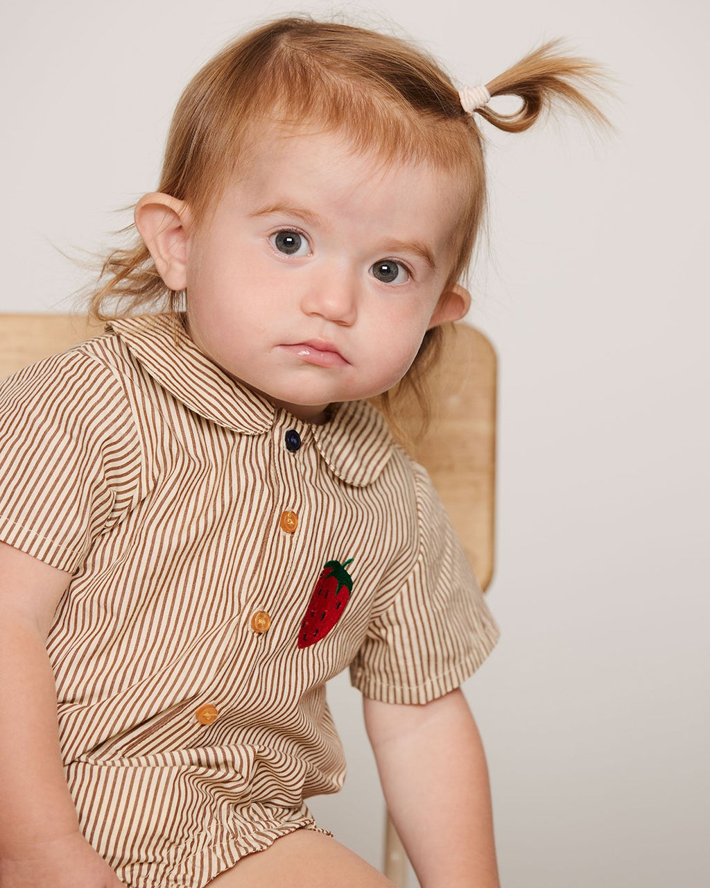 Brown striped baby bodysuit with collar and strawberry embroidery