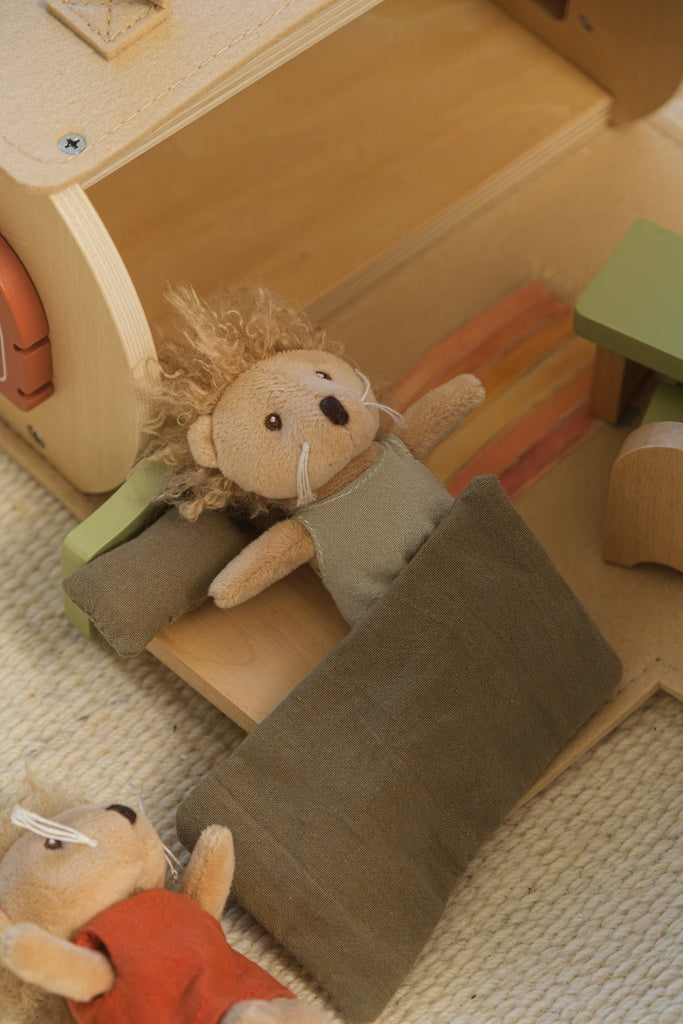 Log house with miniature friends