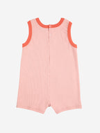 Smiling pink playsuit