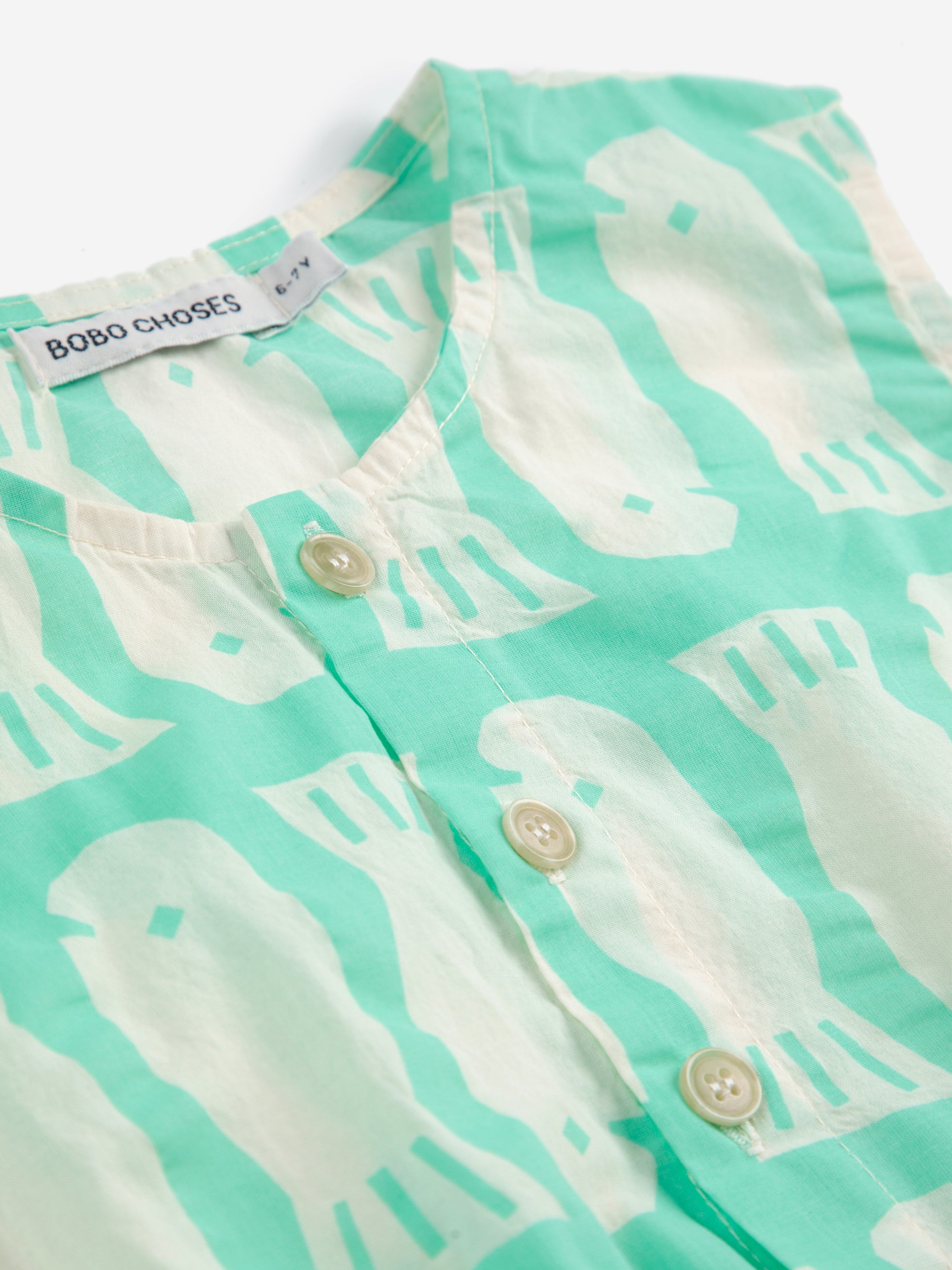 Turquoise dress with printed fish