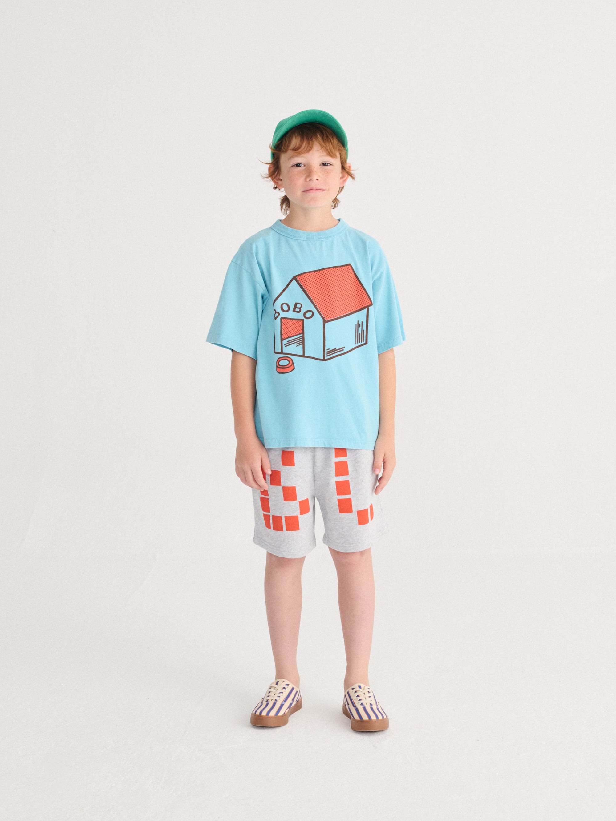 Light blue T-shirt with "Pickles Is At Home" print