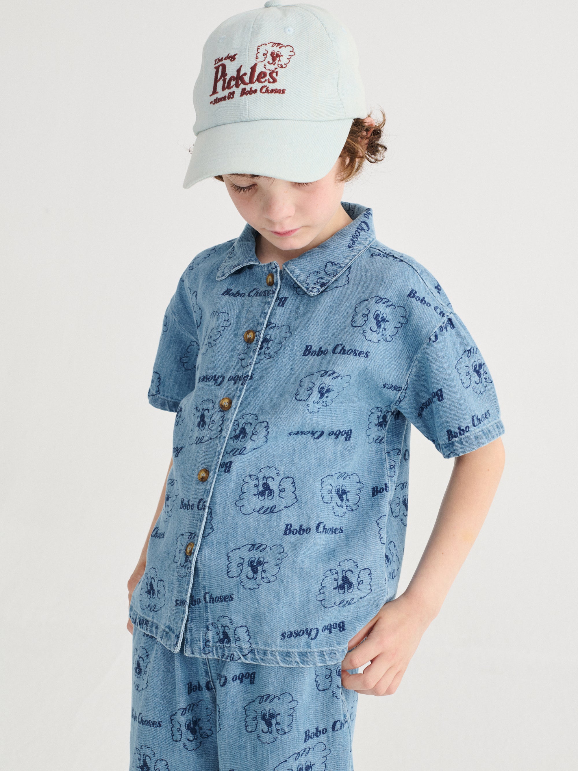 Light Blue Denim Trousers with All Over “Pickles the Dog” Print