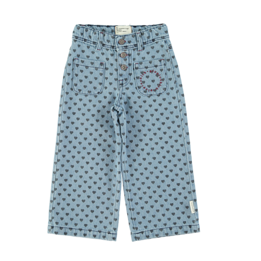 Flare pants in faded blue denim with black hearts
