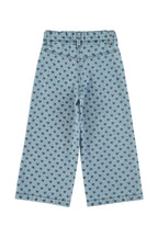 Flare pants in faded blue denim with black hearts
