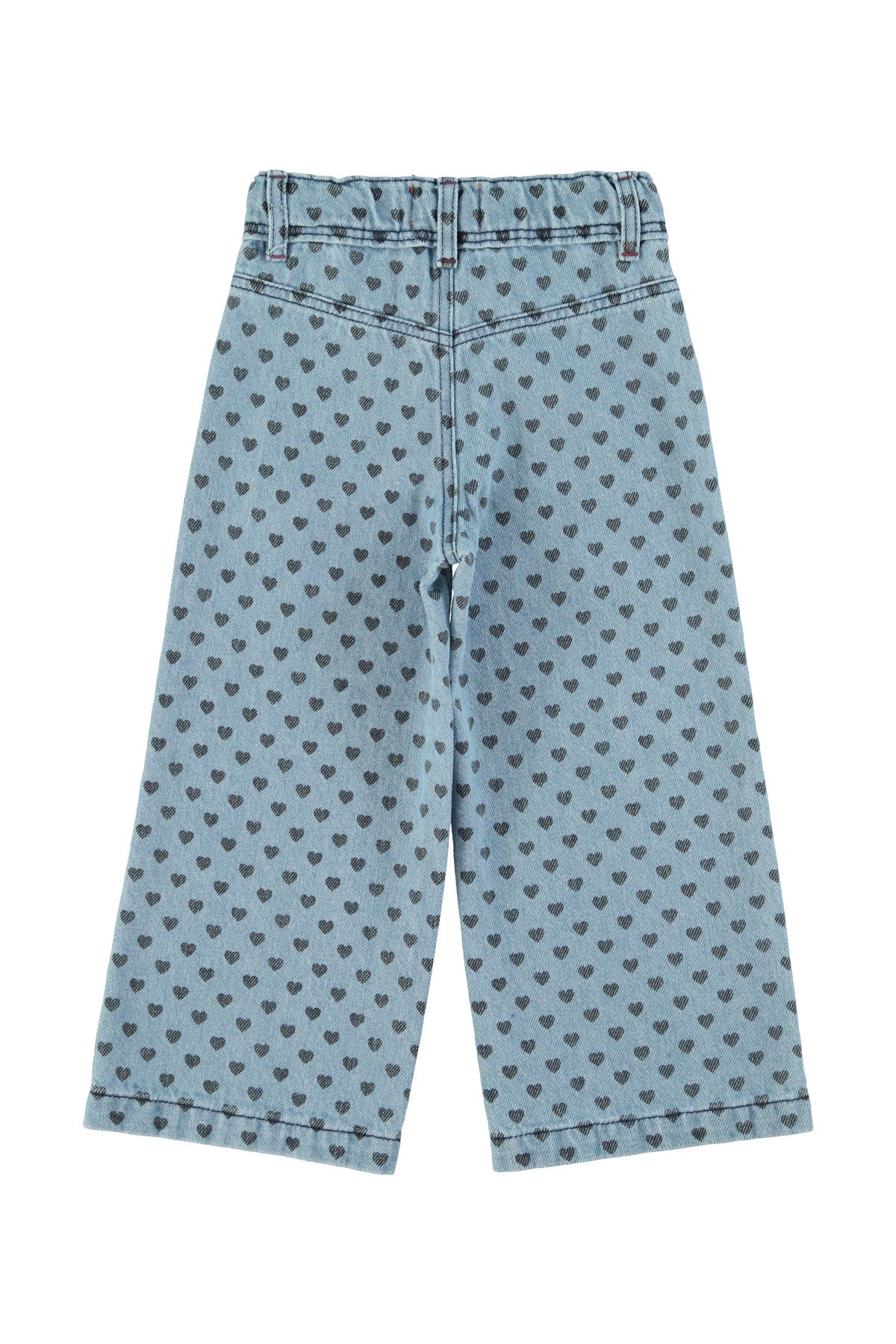 Flare pants in faded blue denim with black hearts