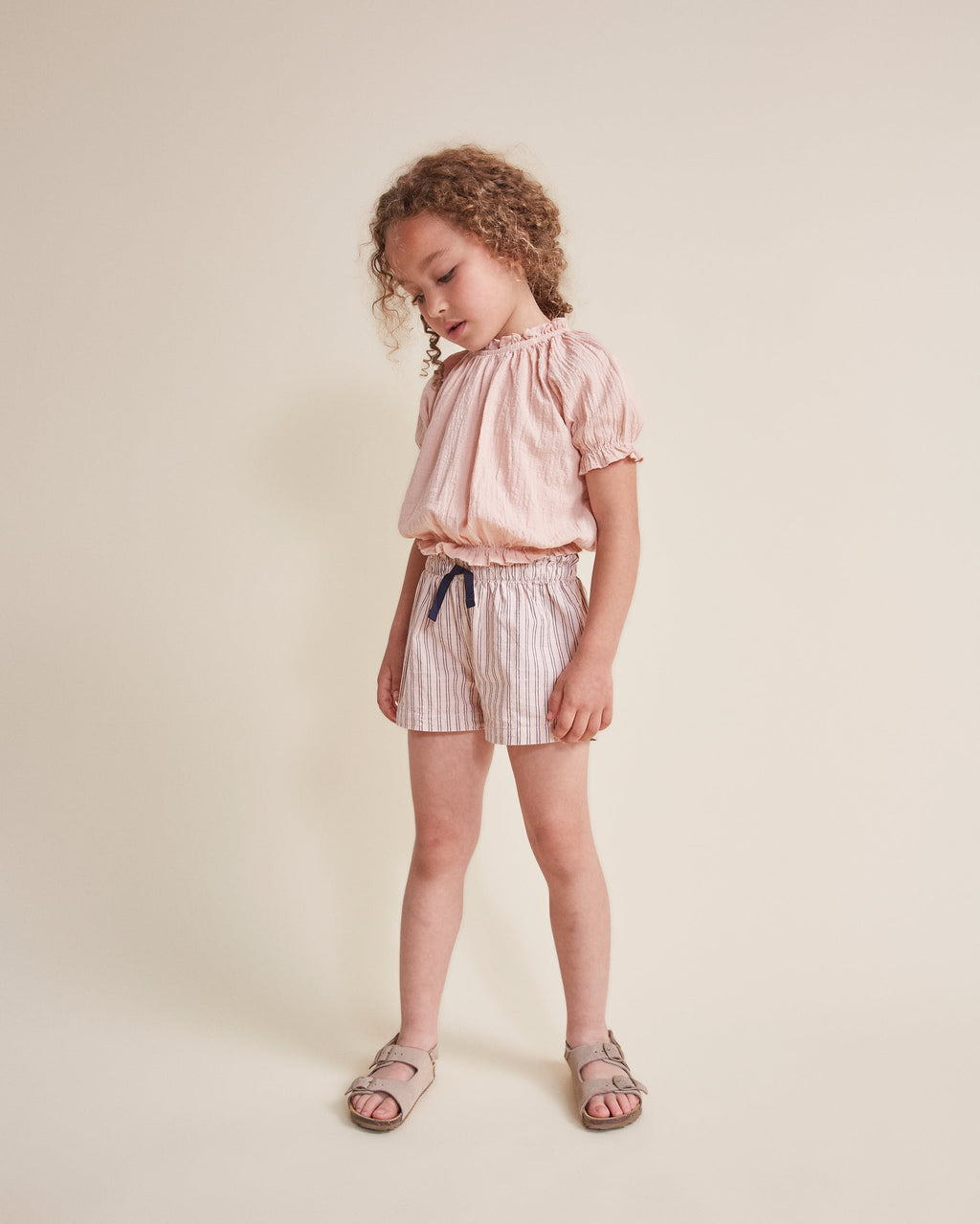 Pink blouse with short sleeves