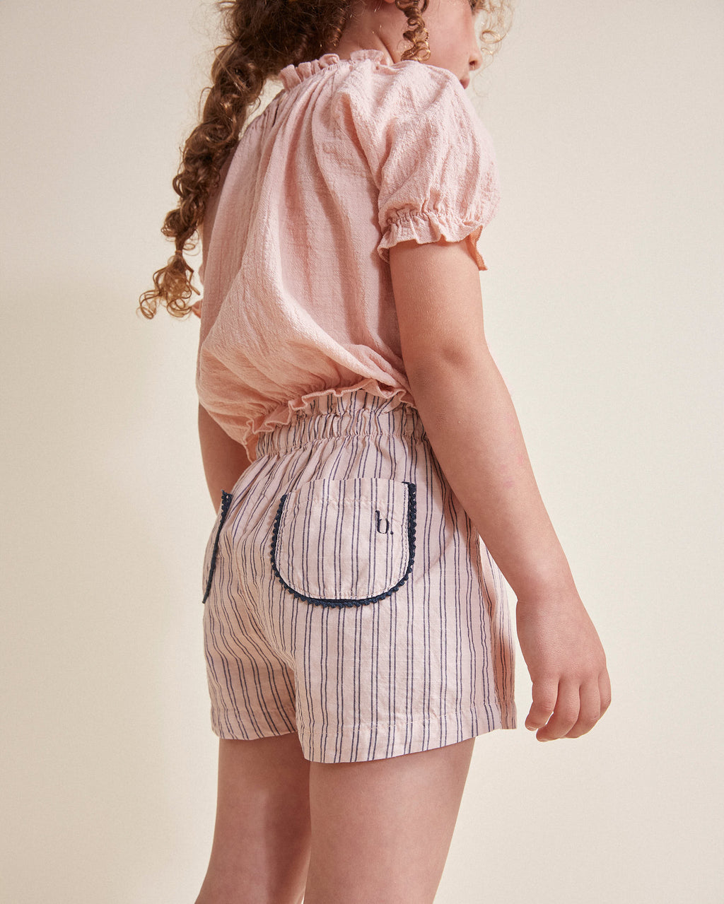 Pink blouse with short sleeves