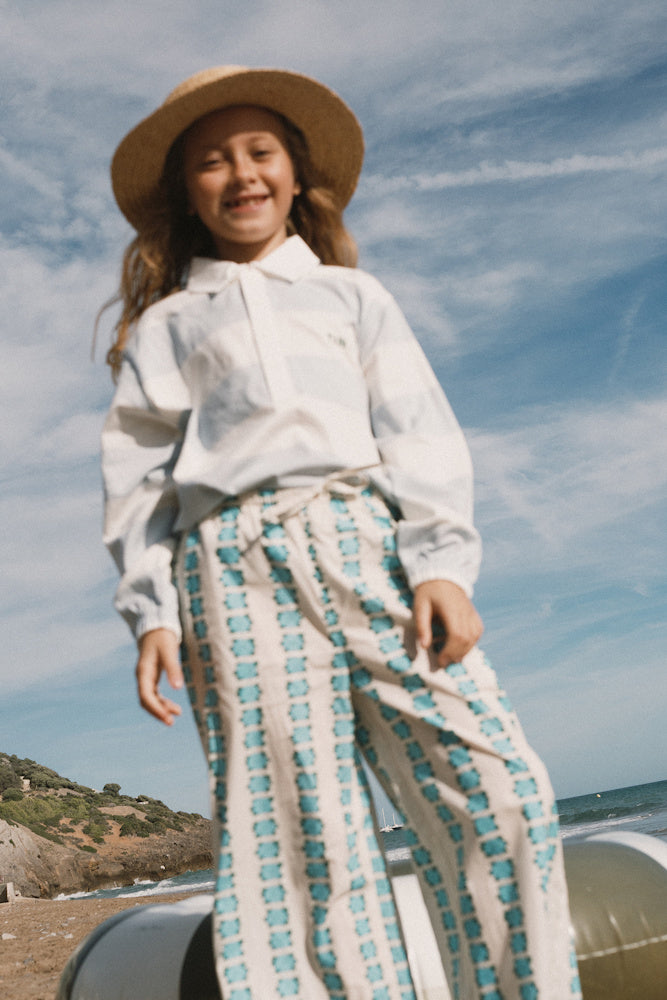 T-shirt Polo Tricoté Manches Longues à Rayures Bleu Clair et Blanc