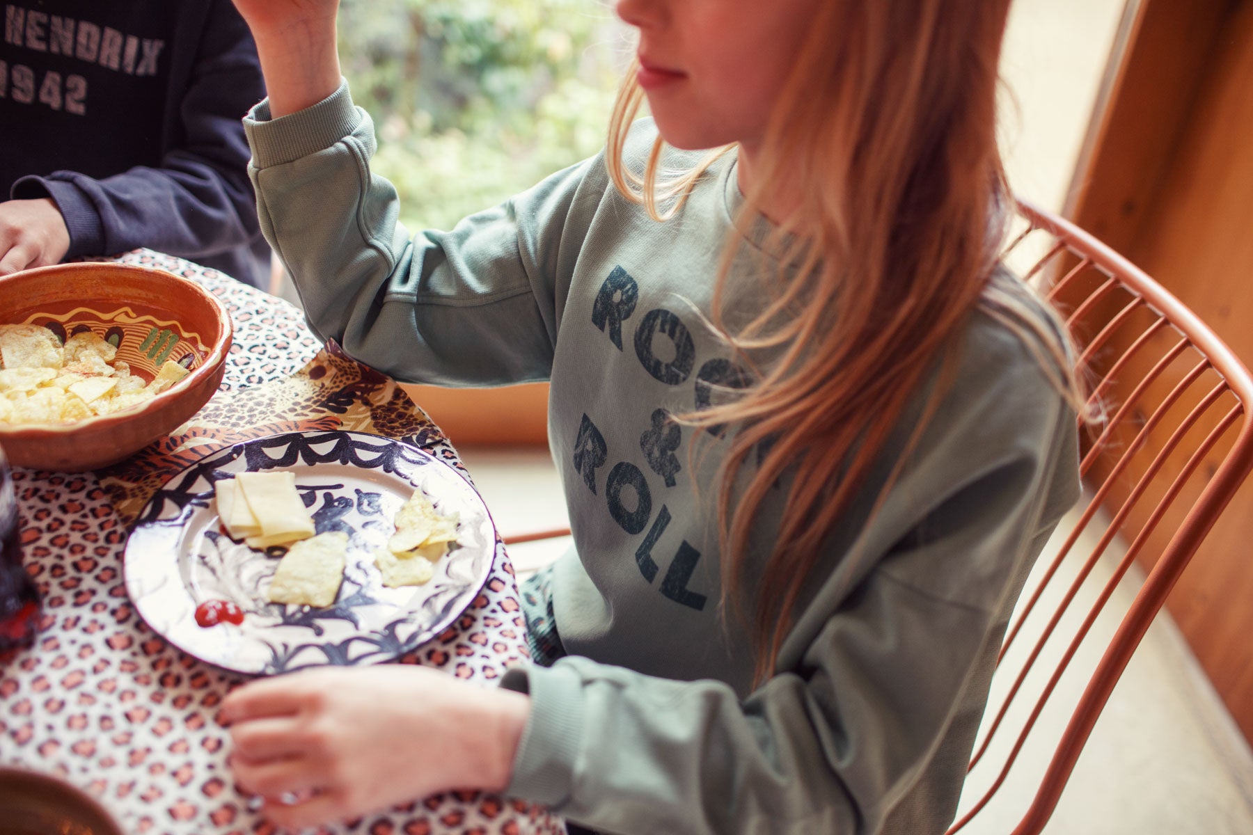 Green sweatshirt with "rock & roll" print