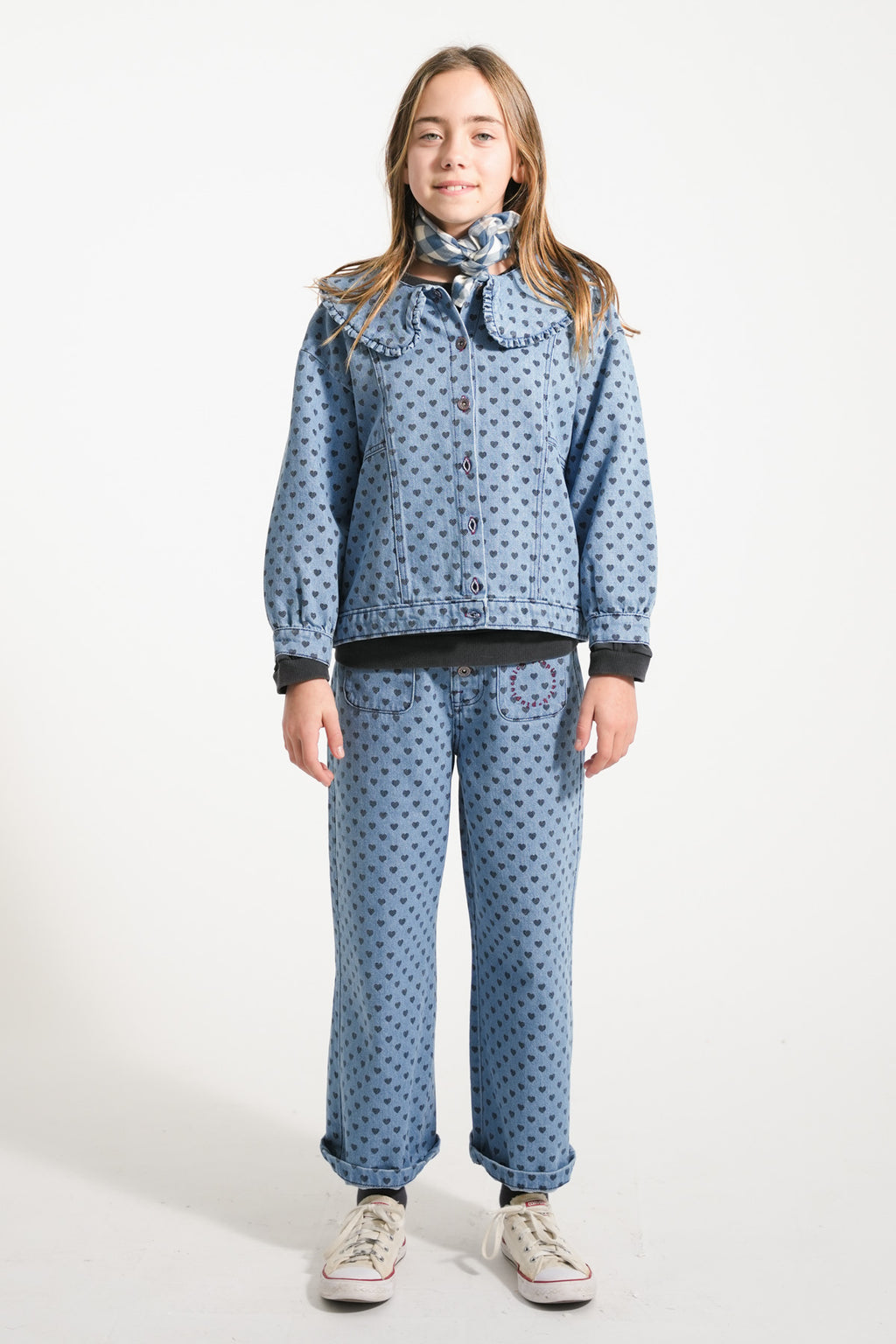 Flare pants in faded blue denim with black hearts