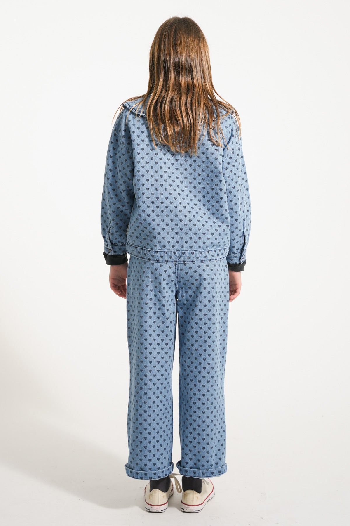 Flare pants in faded blue denim with black hearts