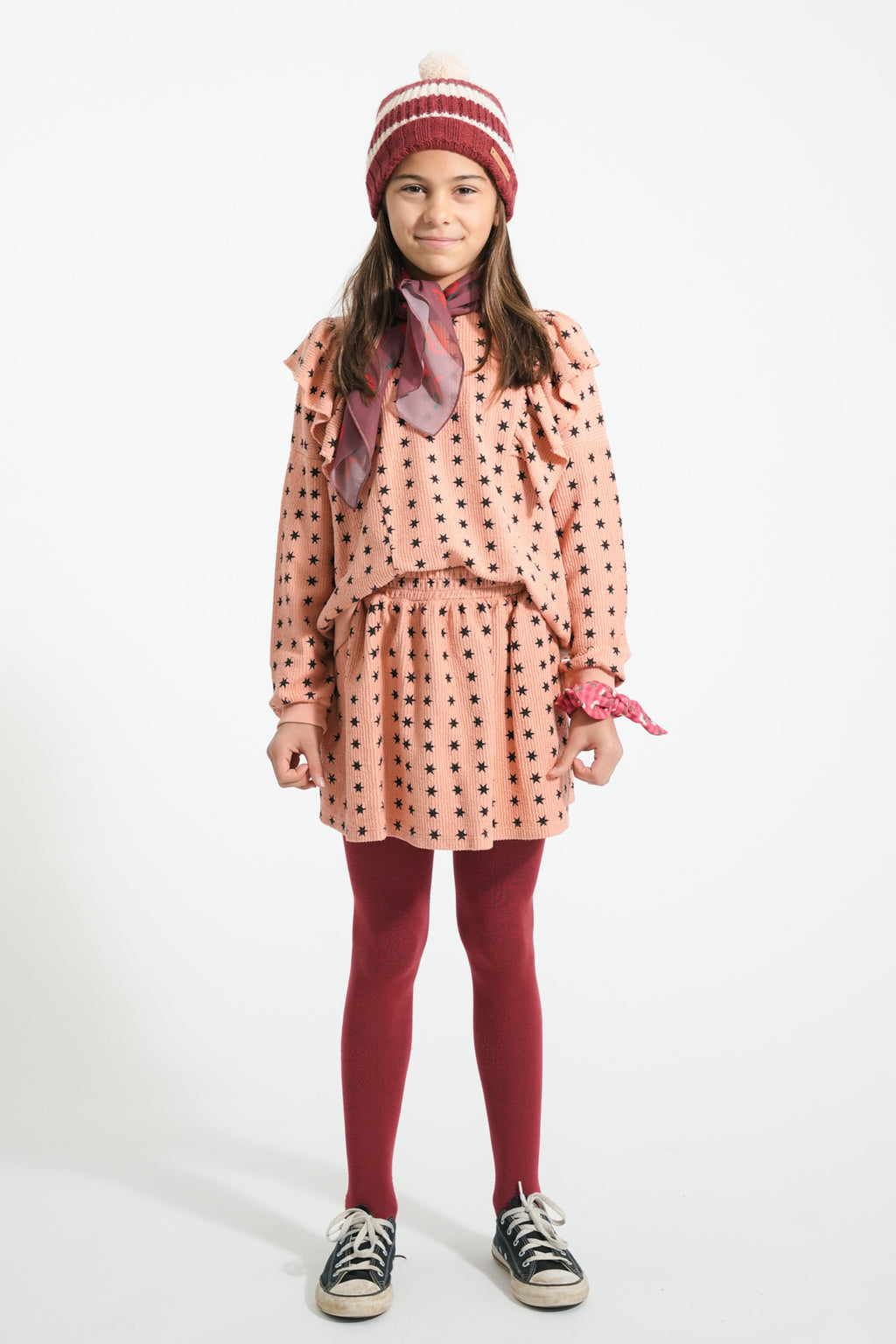 Jupe courte rose à étoiles noires
