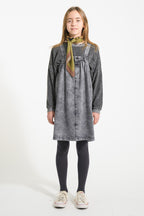 Short dress with washed -down black denim suspenders